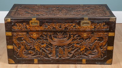 Lot 226 - A carved camphorwood brass-bound chest