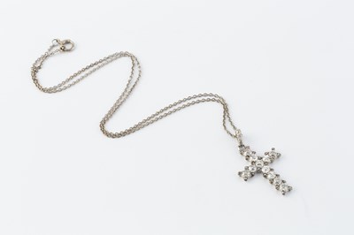 Lot A diamond cross pendant on chain, the...