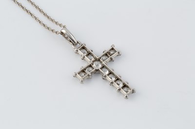 Lot A diamond cross pendant on chain, the...