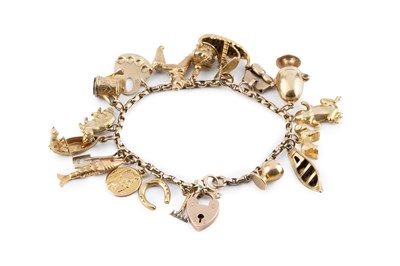 Lot 28 - A charm bracelet, the belcher-link bracelet...
