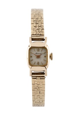 Lot 97 - A 9ct gold bracelet watch, the cushion-shaped...