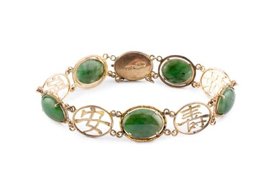 Lot 21 - A nephrite panel bracelet, designed as a line...