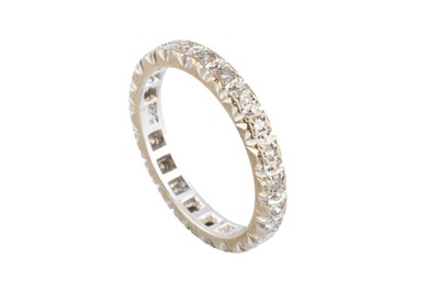 Lot 48 - A diamond full hoop ring, inset with a line of...