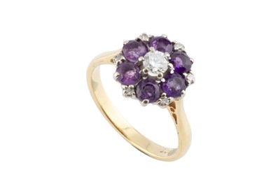 Lot 61 - An amethyst and diamond cluster ring, the...