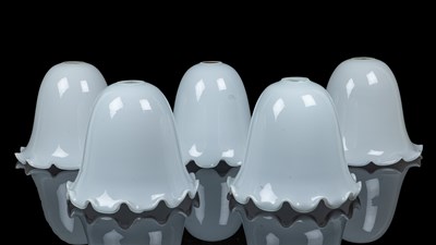 Lot 1054 - A group of four similar white-glass shades