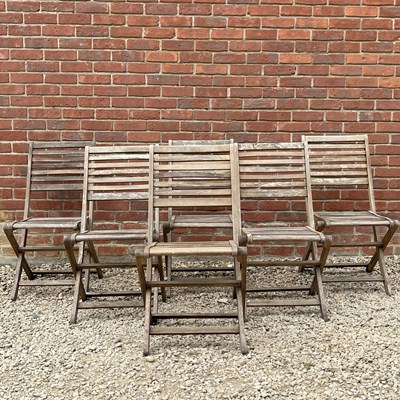 Lot 1323 - A set of six teak folding garden chairs