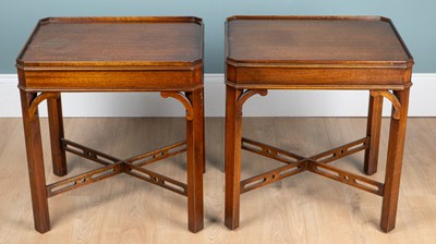 Lot 349 - A pair of reprodux George III-style mahogany bedside tables