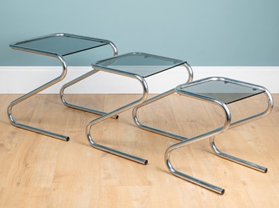 Lot 1167 - A Mid-Century chrome-framed nest of three tables