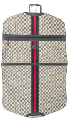Lot 371 - A GUCCI 1980's garment bag in GG monogram...