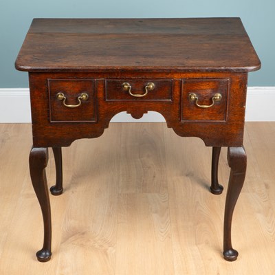 Lot 193 - An 18th century oak lowboy