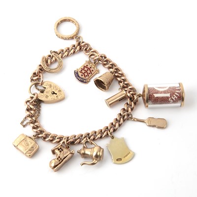 Lot 453 - 9ct gold charm bracelet With assorted charms,...