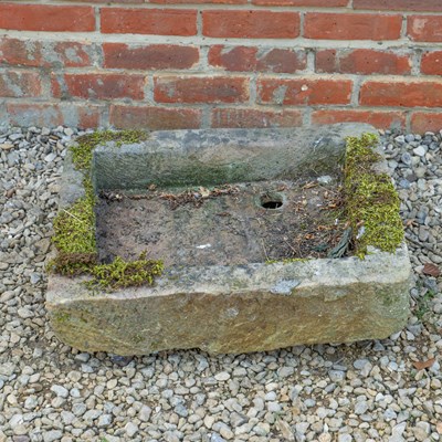 Lot 1353 - A carved limestone trough