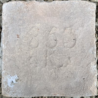 Lot 1208 - A limestone date stone