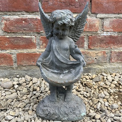Lot 1372 - A garden statuette of a cherub