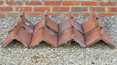 Lot 1354 - A collection of twenty-two terracotta ridge tiles