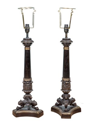 Lot 1186 - A pair of bronze Empire-style table lamps