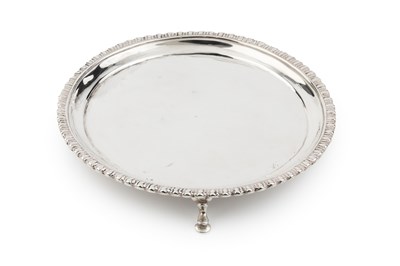 Lot 636 - An early George III silver waiter, of circular...
