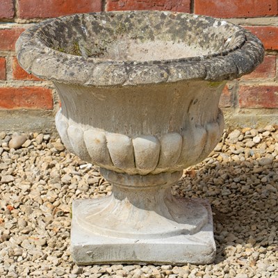 Lot 1271 - A cast composite garden urn
