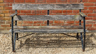 Lot 1366 - A black-painted wrought iron garden bench