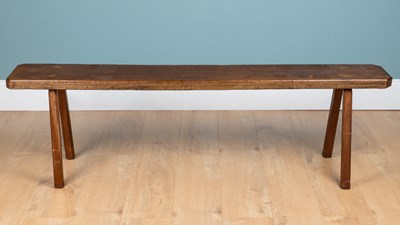 Lot 1125 - A rustic hardwood bench