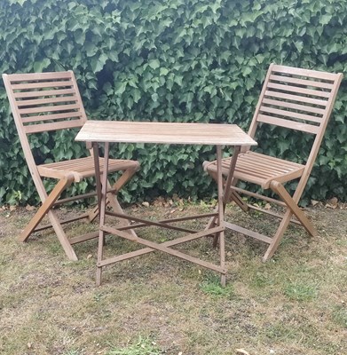 Lot 1256 - A suite of teak garden furniture