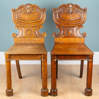 Lot 241 - A pair of William IV oak hall chairs