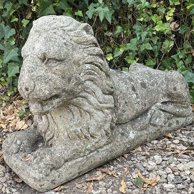 Lot 1337 - A cast composite stone lion