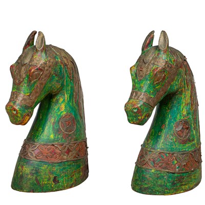 Lot 339 - A pair of Indian green-painted carved wood horse heads