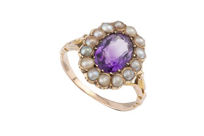 Lot 84 - An amethyst and half pearl cluster ring, with...