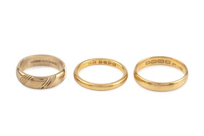 Lot 72 - Two 22ct gold wedding bands, and a 9ct gold...