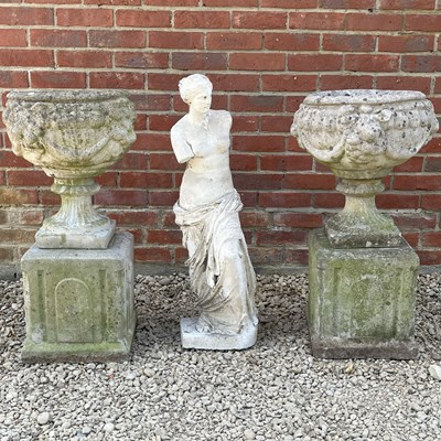 Lot 1371 - A pair of cast composite urns and a garden statue