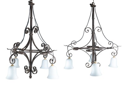 Lot 131 - Pair of wrought iron four-branch chandeliers