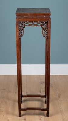 Lot 202 - A Chinese hardwood jardinière stand