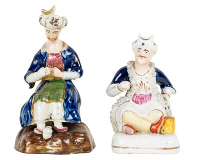Lot 365 - Possibly by John Lloyd, two porcelain figures of seated Turks