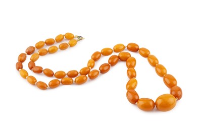Lot 280 - An amber bead necklace, designed as a single...