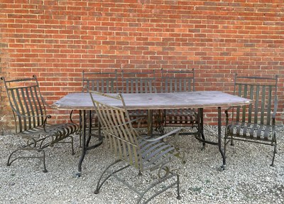 Lot 1262 - A set of six wrought iron spring garden armchairs and a table