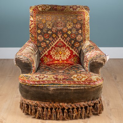 Lot 163 - An upholstered armchair