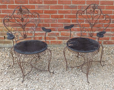 Lot 1286 - A pair of French wrought iron garden armchairs