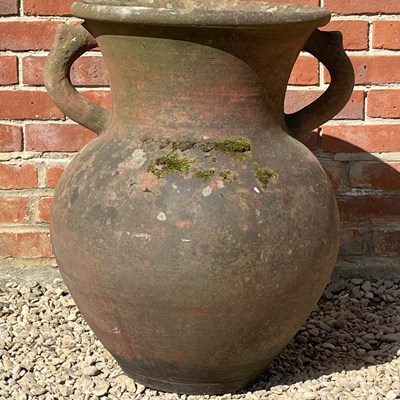 Lot 1298 - An old terracotta jar