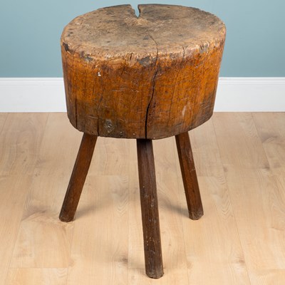 Lot 1124 - An antique rustic elm and oak chopping block
