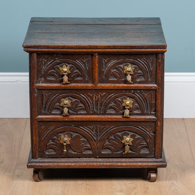 Lot 1055 - An 18th century oak commode
