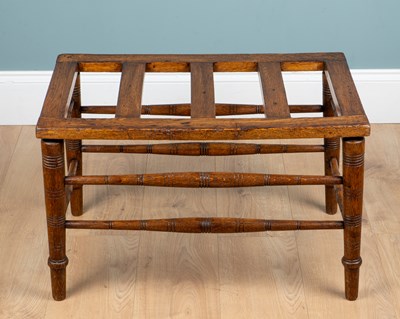 Lot 253 - A late 19th/early 20th century Arts & Crafts-style oak luggage rack