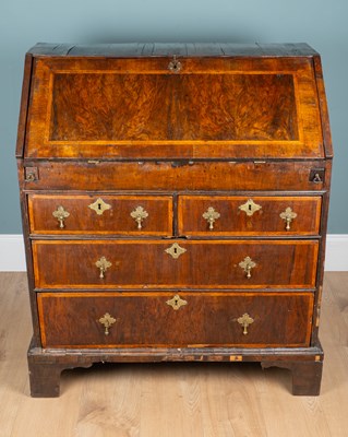 Lot 297 - An 18th century and later walnut bureau