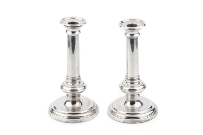 Lot 635 - A pair of silver candlesticks, the plain...
