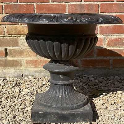 Lot 1325 - A black-painted cast iron campana-style urn