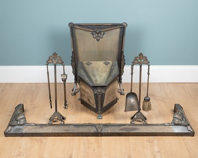 Lot 1044 - An Art Deco set of anodised steel fireside ornaments