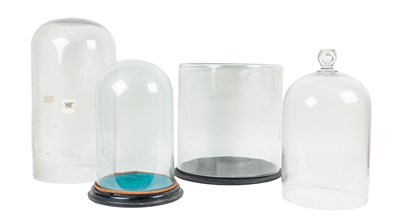 Lot 381 - A group of four glass domes