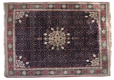 Lot 67A - Large midnight blue ground carpet the design...