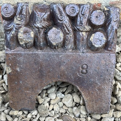 Lot 1324 - A collection of fourteen Victorian treacle-glazed edging tiles
