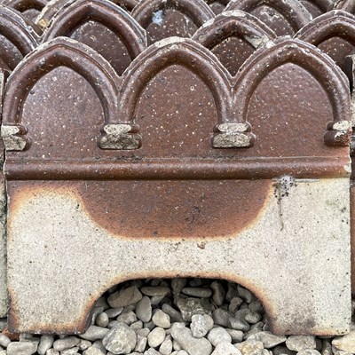 Lot 1299 - A set of thirteen Victorian Gothic edging tiles